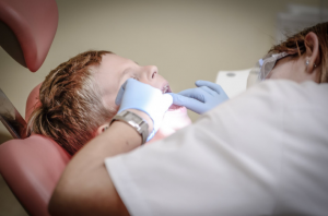 a dentist handling patient